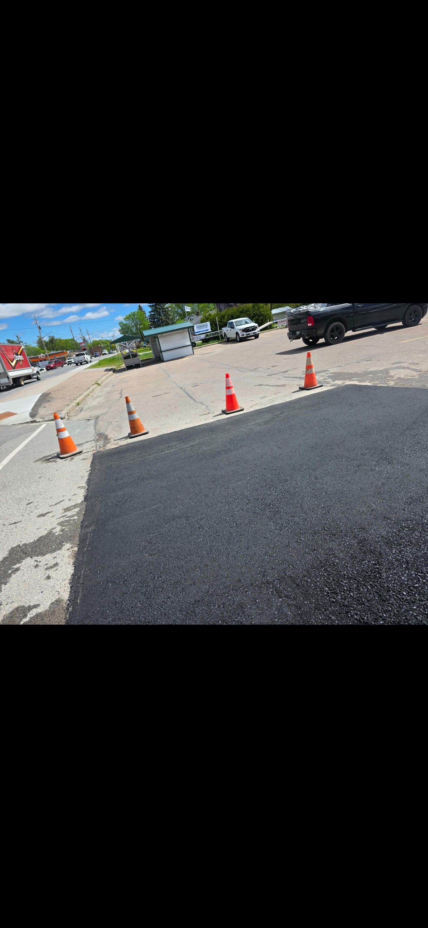 Commercial parking lot patch on a downtown street