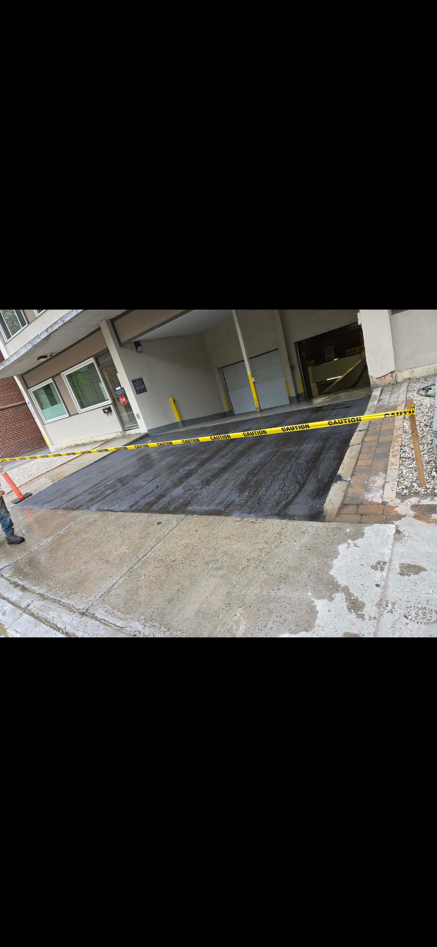 Loading dock ramp repair with fresh asphalt
