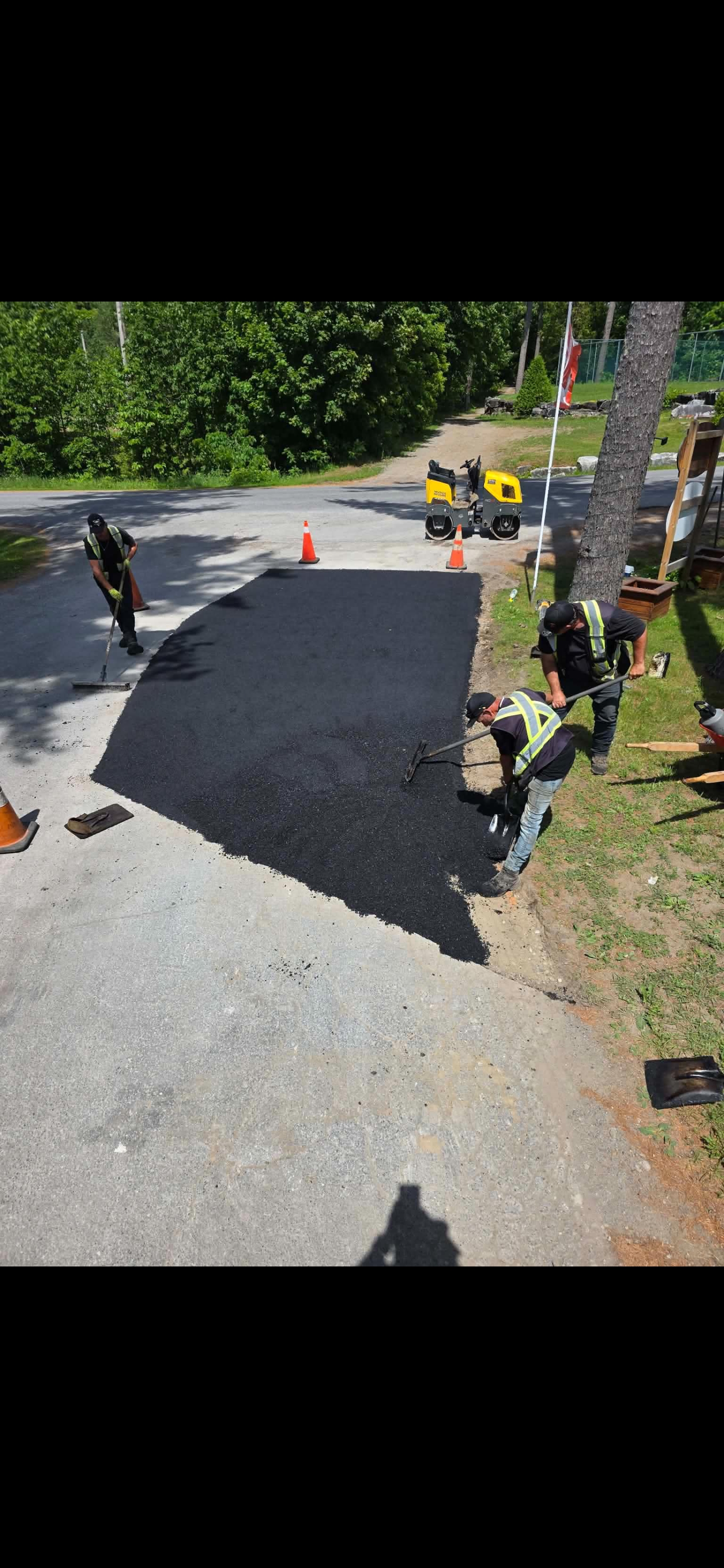 Freshly rolled residential driveway repair