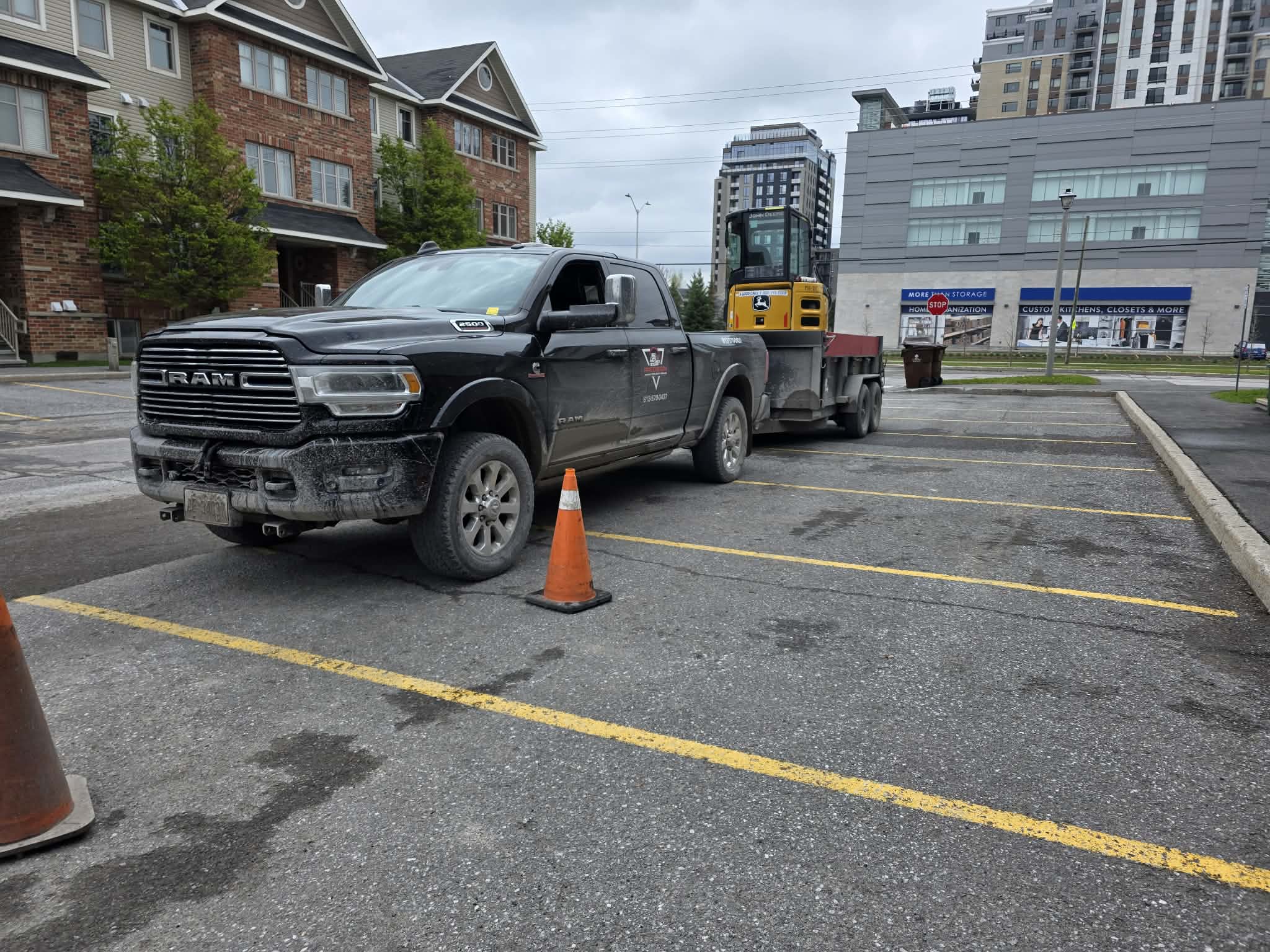 Precision Ram truck & dump trailer on commercial site