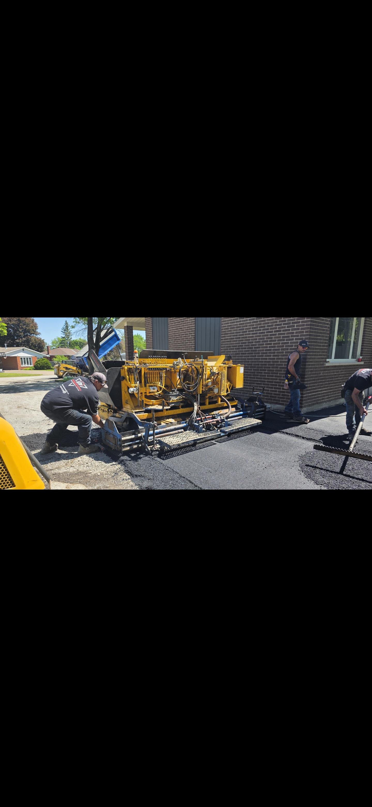 Machine-laid asphalt on a rural driveway